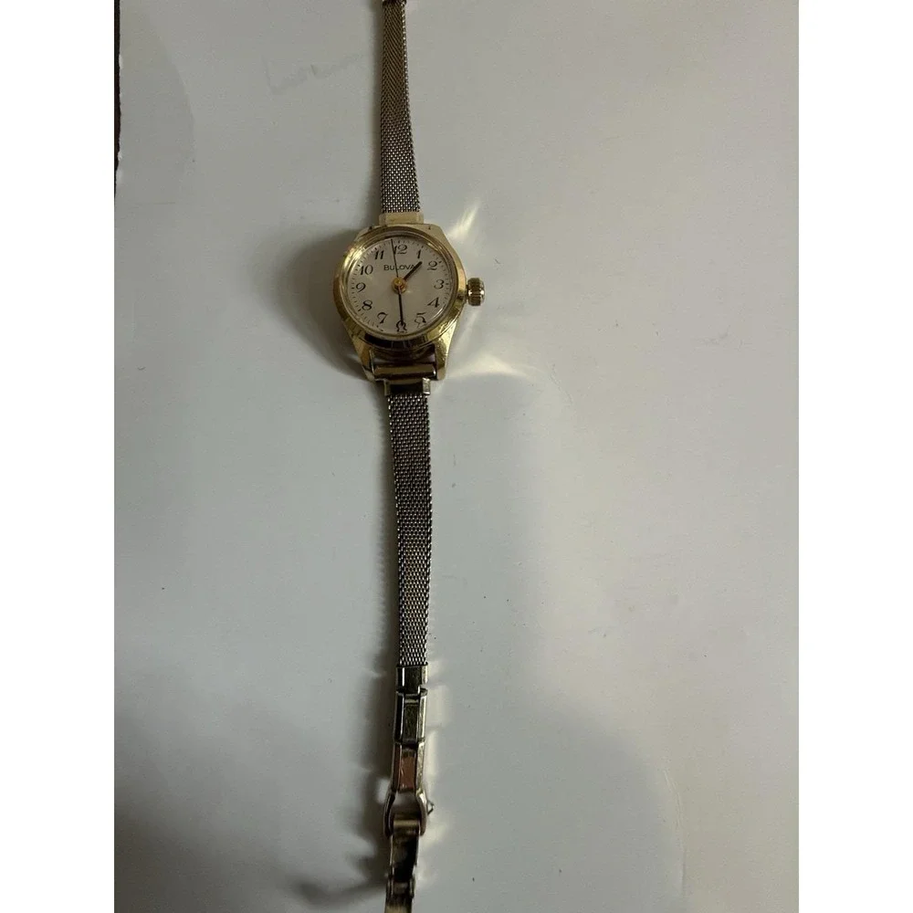 Vintage gold-tone women's mechanical watch by Bulova, manual-wind (mini model)